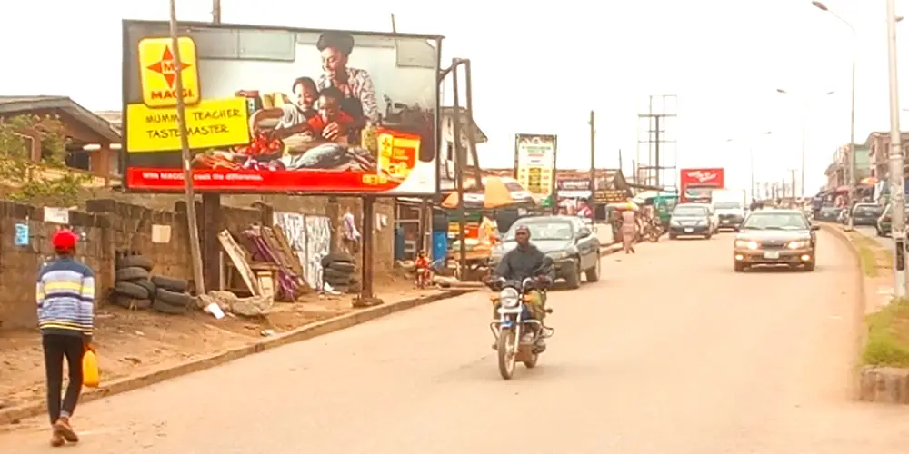 Portrait - Along Kuto Road After Obalipede Market Facing Traffic To Kuto